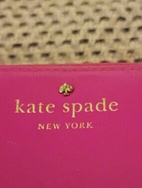 kate spade Bright Pink Wallet with Gold Logo